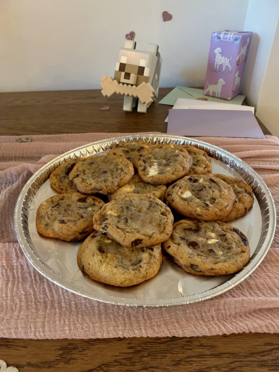 A platter piled with freshly baked chocolate chunk cookies.